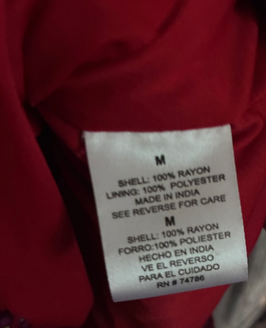 Care label showing size M, shell 100% rayon, lining 100% polyester, made in India
