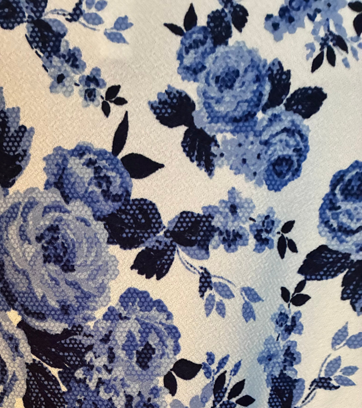 Honey & Lace blue floral rose t-shirt dress hanging on barn door