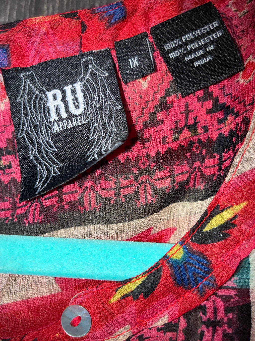 RU Apparel brand label showing size 1X, 100% polyester, made in India